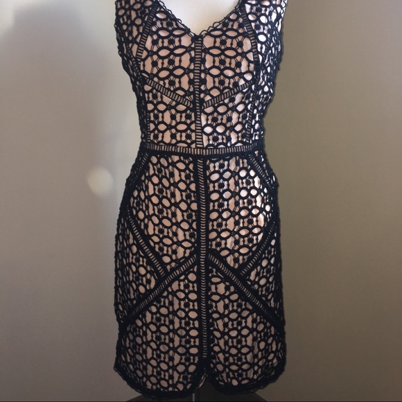 Black cocktail dress with intricate details - Picture 3 of 4